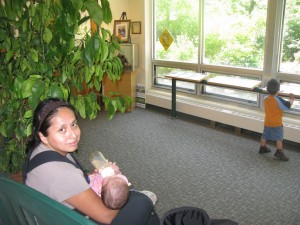 feeding baby in quiet part of center next to discovery room